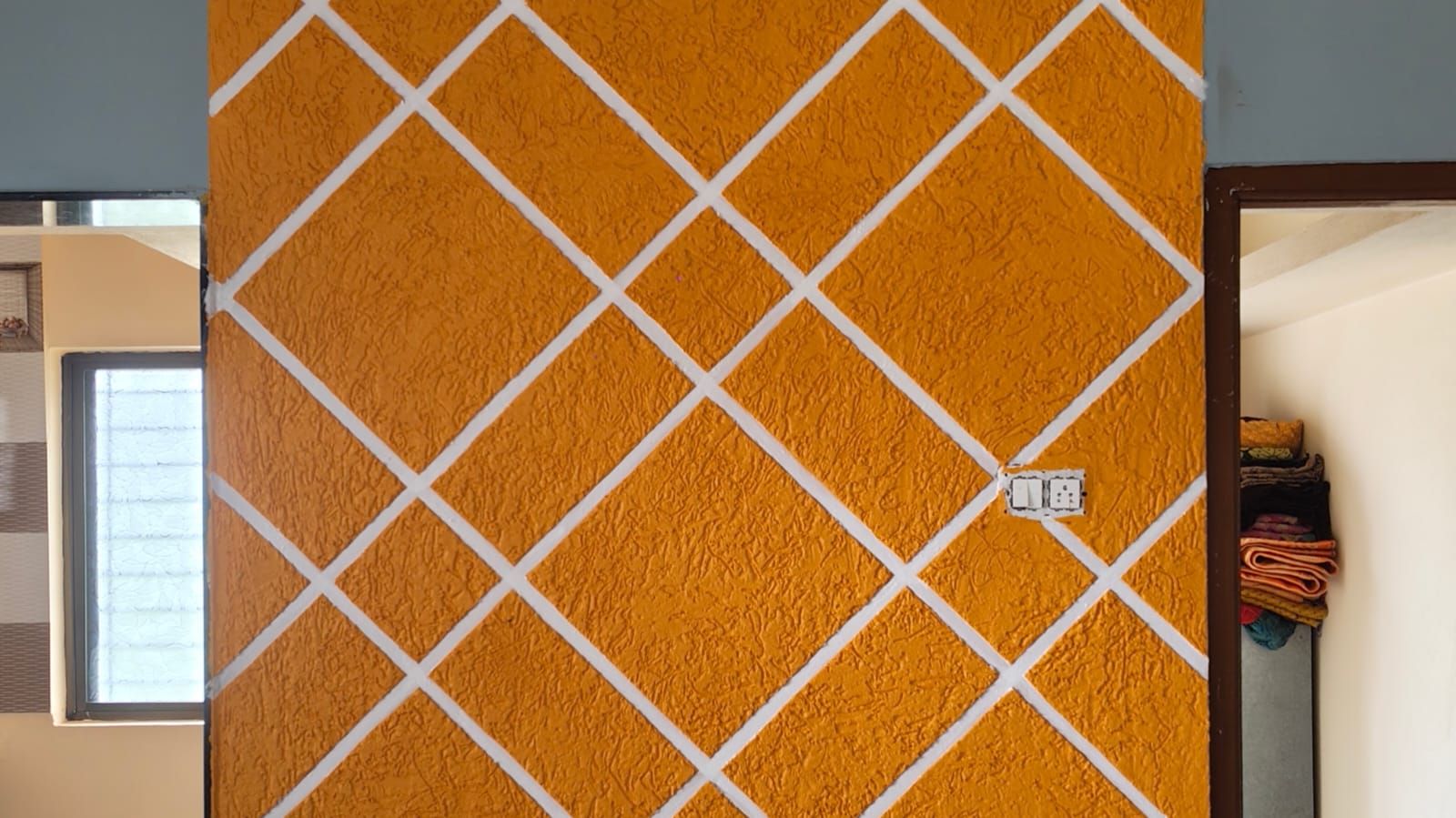 Creative Diamond Pattern Wall Design in Orange Texture | Modern Accent Wall Idea - Painting Services | Swapnapurti Paints